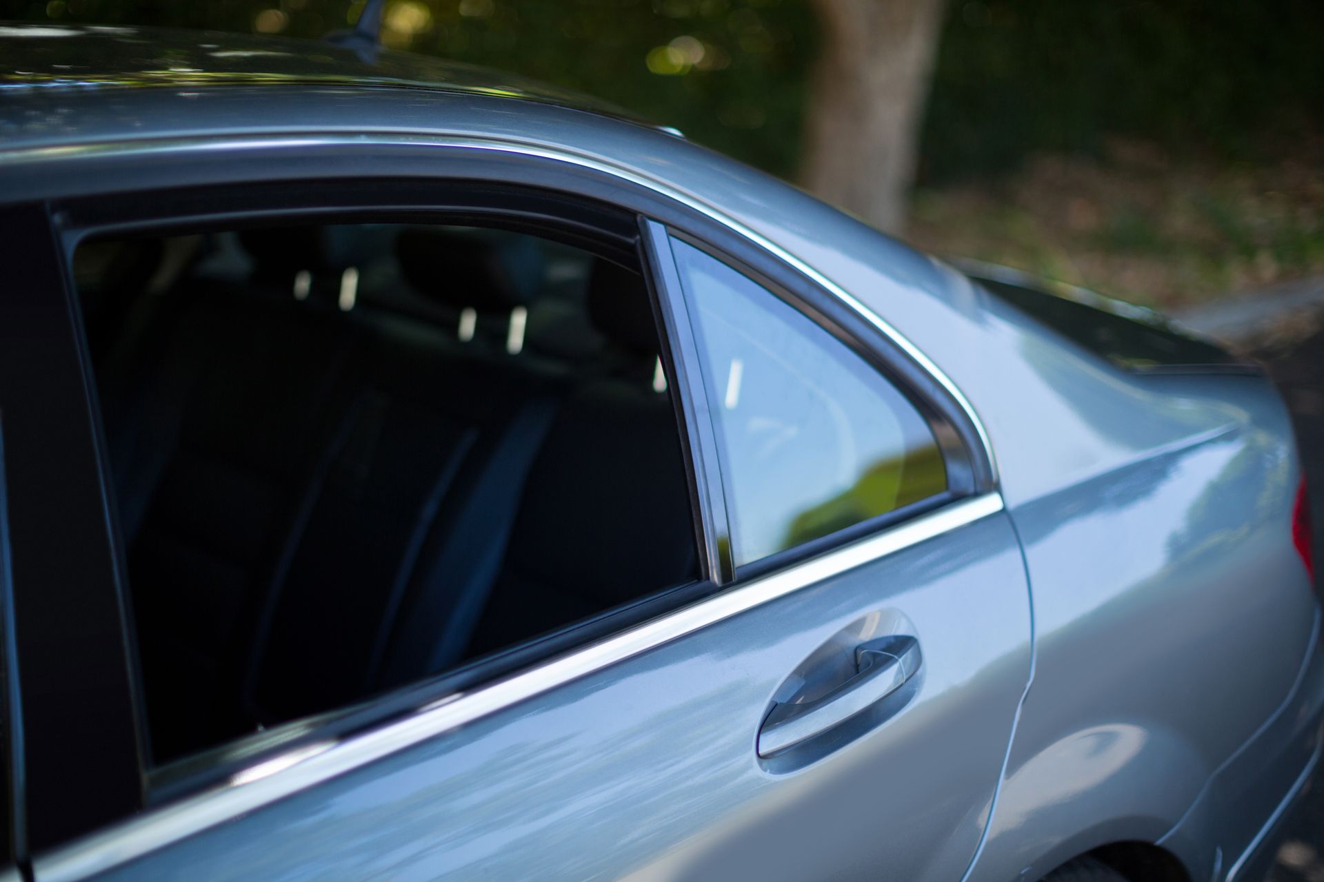 Window tinting installation on vehicle at Auto Xpert Belmont